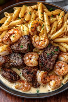 a plate full of pasta and shrimp with sauce