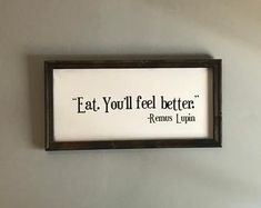 a sign hanging on the wall that says eat you'll feel better if it means iupa