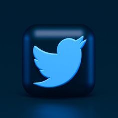 a blue twitter logo on a dark background