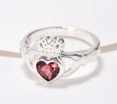 Shining with symbolism and style, this Claddagh ring makes a meaningful gift and everyday reminder of love, loyalty, and friendship. From JMH Jewellery.\n\nOriginal item is J416003. This product may be a customer return, vendor sample, or on-air display and is not in its originally manufactured condition. It may not be new. In some instances, these items are repackaged by QVC. Everyday Reminder, Red Garnet Ring, Claddagh Ring, Trinity Knot, Claddagh Rings, Garnet Ring, Garnet Stone, Garnet Rings, Red Garnet