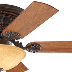 a ceiling fan with wooden blades and a light fixture