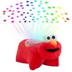 an elmo plush toy with stars in the background