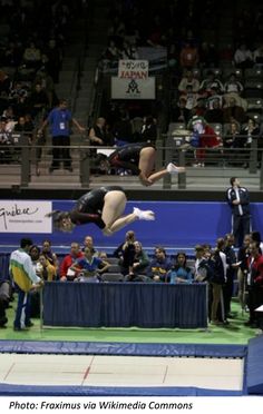 a person jumping in the air on a trampoline