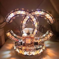 a chandelier with lights on it sitting on a table