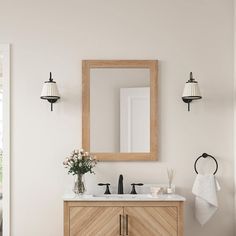 a bathroom with a sink, mirror and towel rack on the wall next to it