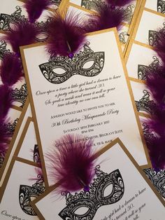 masquerade themed wedding stationery with purple feathers