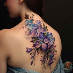 a woman's back with purple flowers on it