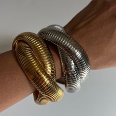 It's always a good time to add a statement piece to your style! This one is for the wild at heart, the bold and the curious. Our Calypso Double Bracelet features two 16mm thick braided bracelets with parallel line ridges. A true jaw-dropping statement piece, crafted with high quality materials for those with a taste for the most elevated pieces. Details Waterproof & Tarnish Resistant Material: Stainless Steel / Stainless Steel dipped in 18k Gold Closure: None - stretches lightly Approximate Meas Everyday Luxury Statement Gold Bracelet, Luxury Gold Statement Bracelet, Chic Gold-plated Cuff Bracelet, Luxury Statement Gold-tone Bracelet, Luxury Statement Cuff Bracelet, Tarnish Resistant, Thick Braid, Glam Jewelry, Freshwater Pearl Jewelry, Wild Hearts