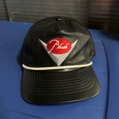 Small Scratch On The Brim Shown In The Last Photo. Very Faint. Great All Around Condition. Snapback Closure. Genuine Hide. Trucker Style With Rope Along Brim. Snapback Hat, Trucker Cap, Snapback Hats, Black Red, Accessories Hats, Genuine Leather, Black And Red, Mens Accessories, Man Shop