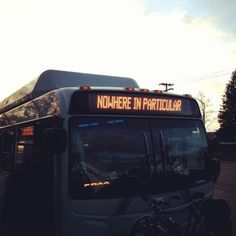 a black and white photo of a bus with the words nowhere in particular written on it