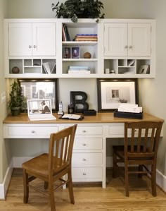 a desk with two chairs and a book shelf above it in a home office area