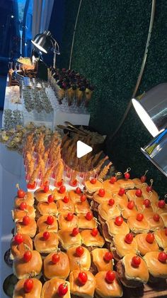 an assortment of pastries on display at a buffet