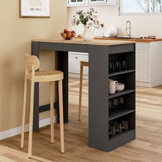 a kitchen island with two stools next to it