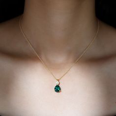 Product Details This Teardrop Necklace is a stunning piece, crafted from Solid Gold and set with a Prong Setting that encases a beautiful Pear Shape Lab Created Emerald and Brilliant Round Zircon. The combination of these stones creates a mesmerizing effect, making it a perfect accessory to elevate any outfit. Product Information SKU SHP-PENDANT082019877 Length 17 mm Width 8 mm Height 5.5 mm Weight 3.60 gm (Approximate) LAB CREATED EMERALD INFORMATION No.of Stones 1 Pieces Total Weight 2.50 Carat (Approximate) Dimension(approx) Pear-8X10 mm-1 Pcs Color Green Cut Brilliant Shape Pear Setting Type Prong-Setting Quality Grade AAAA ZIRCON INFORMATION No.of Stones 1 Pieces Total Weight 0.32 Carat (Approximate) Dimension(approx) Round-4X4 mm-1 Pcs Color White Cut Brilliant Shape Round Setting Ty Gold Necklace With Green Stone, Gold And Emerald Necklace, Emerald Jewelry Necklace, Gold Emerald Necklace, Emerald Pendants, Green Emerald Necklace, Emerald Necklaces, White Stone Jewelry, Emerald Green Jewelry