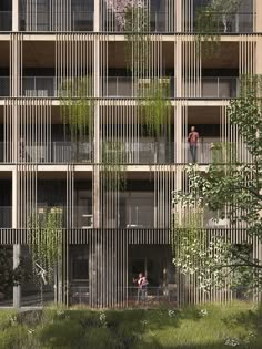 two people standing on the balconies of an apartment building with plants growing out of them