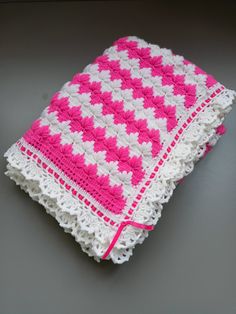 HAND KNITTED BABY BLANKET FOR BABY AND STROLLER This lovely handmade blanket is perfect for keeping your little one warm and cozy. The intricate crochet design showcases a beautiful white and pink floral theme, making it an ideal addition to any nursery.  It is suitable for both boys and girls, and can easily fit a toddler bed. This blanket would also be an excellent baby shower gift that would be treasured for years to come. Crocheted with high quality, super soft acrylic yarn Machine wash, col Blanket For Baby, Intricate Crochet, Knitted Baby Blanket, Crochet Food, White Blanket, Crochet Design, Knitted Baby, Handmade Blanket, Floral Theme