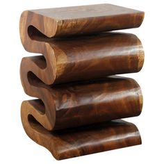 three wooden pieces stacked on top of each other