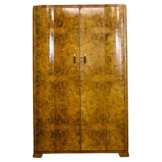 an antique wooden armoire with two doors