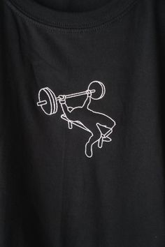 Feel strong and set new bench PRs with our embroidered bencher tee! Regardless of what sport you love, the bench is a sure way to help build upper body strength. Express your love for lifting and all things fitness when wearing this soft and comfy shirt. If you like this, be sure to check out the embroidered lifter again in the squat, deadlift, and more in our store. This is a unisex shirt; we recommend buying your standard size. This shirt is made to order. For production time estimates, please Gym Tshirt Design Ideas, Gym Tshirt Design, Squat Bench Deadlift, Gym Tshirt, Gym Lover, Gym Ideas, Embroidery Tshirt, Body Strength, Shirt Design Inspiration