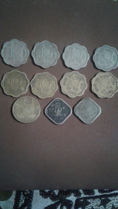 six different types of coins sitting on top of a table