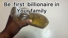 a hand holding a bottle with the words be first billionaire in your family