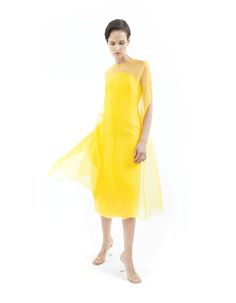 Dune Yellow cape gown made from silk organza, features wide A-line silhouette, round neck, midi length, hook-buttoning on the back and no lining.Offered with matching bustier midi dress sold separately (as shown on pictures) or with lining on request. Flower application is on request with no surcharge. 100% Silk organzaNo liningHook button on the backDry cleanMade in Milan