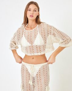 Ooh la la...we're all about the lace! The Gigi Top is the cutest little crop with a three-quarter sleeve and detailed Ibiza Lace fabric. Pair it with the coordinating Sundown Pant to make a set that will take you from day to night. Crop Top 3/4 Sleeve Ibiza Lace Size XS-XL, 1X-3X 86% Polyester / 14% Cotton Style # GGITP24A Model Measurements: Daria, size S - Height 5’9.5”, Bust 34, Waist 24.5, Hips 36 Fitted Half Sleeve Beach Tops, Cropped Lace Top With Crochet Details, Spring Lace Top With 3/4 Sleeves, Spring Lace Crochet Crop Top, 3/4 Sleeve Lace Tops With Lace Trim, Lace Tops With 3/4 Sleeve And Lace Trim, Lace Crop Top With Lace Trim For Vacation, Spring Open Knit Top With 3/4 Sleeves, Open Knit Top With 3/4 Sleeves For Spring