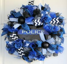 a police wreath with blue and black decorations