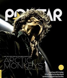 a man with long hair is on the cover of a magazine that has an advertisement for arctic monkeys