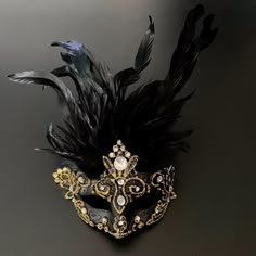 "Be the mysterious black/gold mask at your party with this feathered mask with elastic band. This mask is sure to be a hit at a musical too!" Mascarade Quince, Masquerade Ball Outfit Ideas, Mascarade Ball Outfit, Black And White Masquerade Party, Victorian Masquerade Ball, Mascarade Party Outfit, Mask For Masquerade Ball, White Masquerade Party, Masquerade Mask Ideas