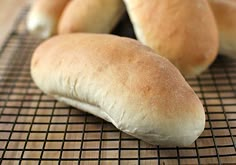 two loaves of bread sitting on a cooling rack