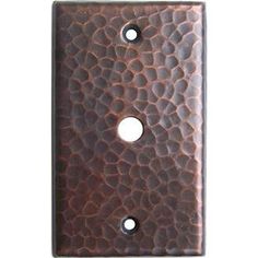 a brown wall plate with two holes in it