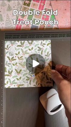 someone is making a paper christmas card with the words double fold treat pouch on it