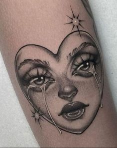 a woman's face with tears and stars on her arm