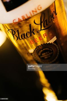 a bottle of black label beer sitting on top of a table