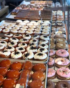 many different kinds of donuts are on display