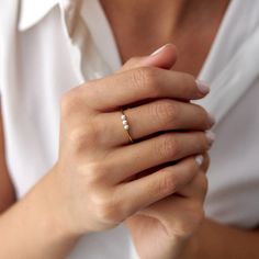 Our lovely minimal 14k solid gold pearl ring. Simple and elegant. 14K solid gold is perfect for everyday wear since it will never tarnish, and you don't have to worry about contact with conditioners or water. A perfect ring to stack as well. ★ Ring Features• Gold Kt: 14K Solid Gold (All rings are stamped for authenticity)• Available Gold Color: Yellow Gold• Man made pearls• Band Width: 1.4 mm Pearl Rings In Gold Simple, Gold Ring Pearl, Dainty Pearl Ring With Single Diamond For Promise, 14k Gold Pearl Ring With Single Diamond For Promise, Minimalist Pearl Ring With Single Diamond For Promise, Minimalist Pearl Promise Ring With Single Diamond, Minimalist Pearl Promise Ring With Diamond, Minimalist Pearl Ring With Single Diamond, Stackable 14k Gold Pearl Ring With Round Band