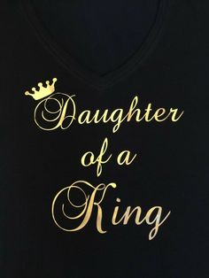 a black shirt with gold lettering that says daughter of a king