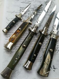 five different types of knives on top of a piece of paper