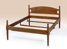 a wooden bed frame with no headboard and foot board on the bottom side, against a white background