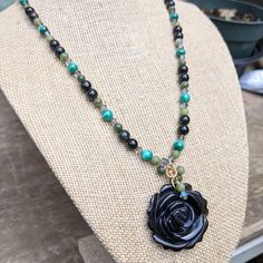 This Handmade Necklace Was Created Using A Carved, Black Onyx Centerpiece Accented With Serpentine Beads, Hanging From Gold-Filled Wire. The Necklace Features Serpentine, Obsidian, Natural Malachite, And Swarovski Crystals. There Are Tiny Faceted, Emerald Green Czs Near The Clasp End Of The Piece. It Has A Gold-Filled Hook Clasp Closure With An Extender. Necklace Length (Around) 17 1/2" Plus A 2" Gold-Filled Extender. Pendant Is 1 1/2" Long And 1 1/4" Across. Gf Necklace, High Fashion Earrings, Topaz Color, Purple Necklace, Party Necklace, Cluster Necklace, Hook Clasp, Gold Tone Necklace, Rhinestone Necklace