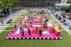 an inflatable playground with people playing on it