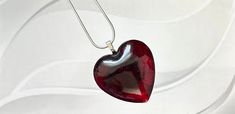 This sophisticated Bodacious Heart Necklace is the perfect finishing touch to any ensemble. Intricately crafted with 18" of sterling silver chain, resin and mica powders, it stands out with bold coloring and eye-catching attention. Custom colors are available with request, and pairing with the Bodacious Heart Ring completes the look. Check out our Bodacious Heart Ring. Modern Resin Jewelry For Gifts, Modern Resin Jewelry Gift, Unique Red Heart Shaped Jewelry, Resin Heart Charm Pendant Jewelry, Unique Red Heart-shaped Necklace, Silver Jewelry With Glossy Finish For Gift, Modern Red Necklace For Gift, Modern Red Necklace Perfect As A Gift, Valentine's Day Resin Jewelry With Heart Charm