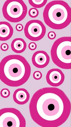 pink and white circles with black dots in the center on a light purple background that looks like an eyeball