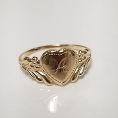 "Thanks for shopping our vintage estate store. We tend to sell well below wholesale and truly hope you enjoy all of our items. Many of the items are one of a kind, so please enjoy scrolling through the pictures and hopefully something will catch your eye. Brown spots are from camera or reflections. Estate 14k yellow gold monogram cursive capital A heart ring. The A has an extra line, thus, we added 4 pictures to show you this A is different. Rings shows the normal A without the extra line.  Ring size: 3  Setting: 7.5mm 1/4\" to 3/8\" Band width: 1.4mm Weight: 1.0 grams Marked 14k and it's sweet. One that you will love." Mariah Core, Cursive M, Antique Style Rings, Lifestyle Women, Gold Link, Gold Monogram