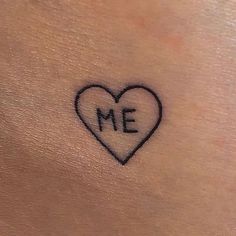 a small heart with the word me written on it's side, in black ink