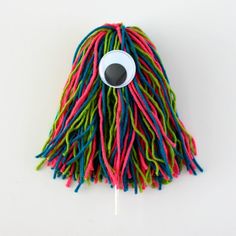 a multicolored lollipopo with an eye on it's side