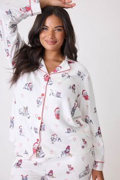 Celebrate the season in style with this charming 'Candy Cane Lane' collared PJ set, featuring a delightful pattern of holiday dogs donning festive red hats. The classic collared top exudes a timeless elegance, while the soft fabric ensures comfort during cozy nights. With its cheerful design, this pajama set brings a playful touch to your winter wardrobe, making it ideal for holiday gatherings, gift giving, or simply enjoying a festive movie night. Embrace the joy of the season with this adorabl White Cotton Christmas Sleepwear, Casual Christmas Sleep Sets, Women’s Christmas Pj Set, Playful Cotton Holiday Sleepwear, Winter Sleepwear With Character Print, Short Kaftan, Tie Waist Pants, Dog Holiday, Collar Top