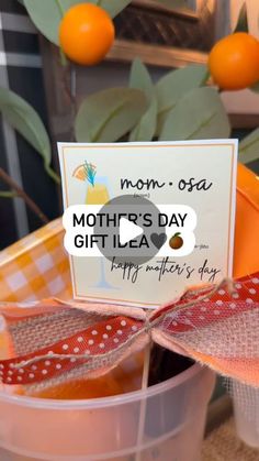 a mother's day gift idea with oranges in the background and a sign on top