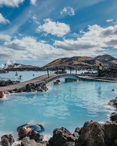 people are swimming in the blue lagoon